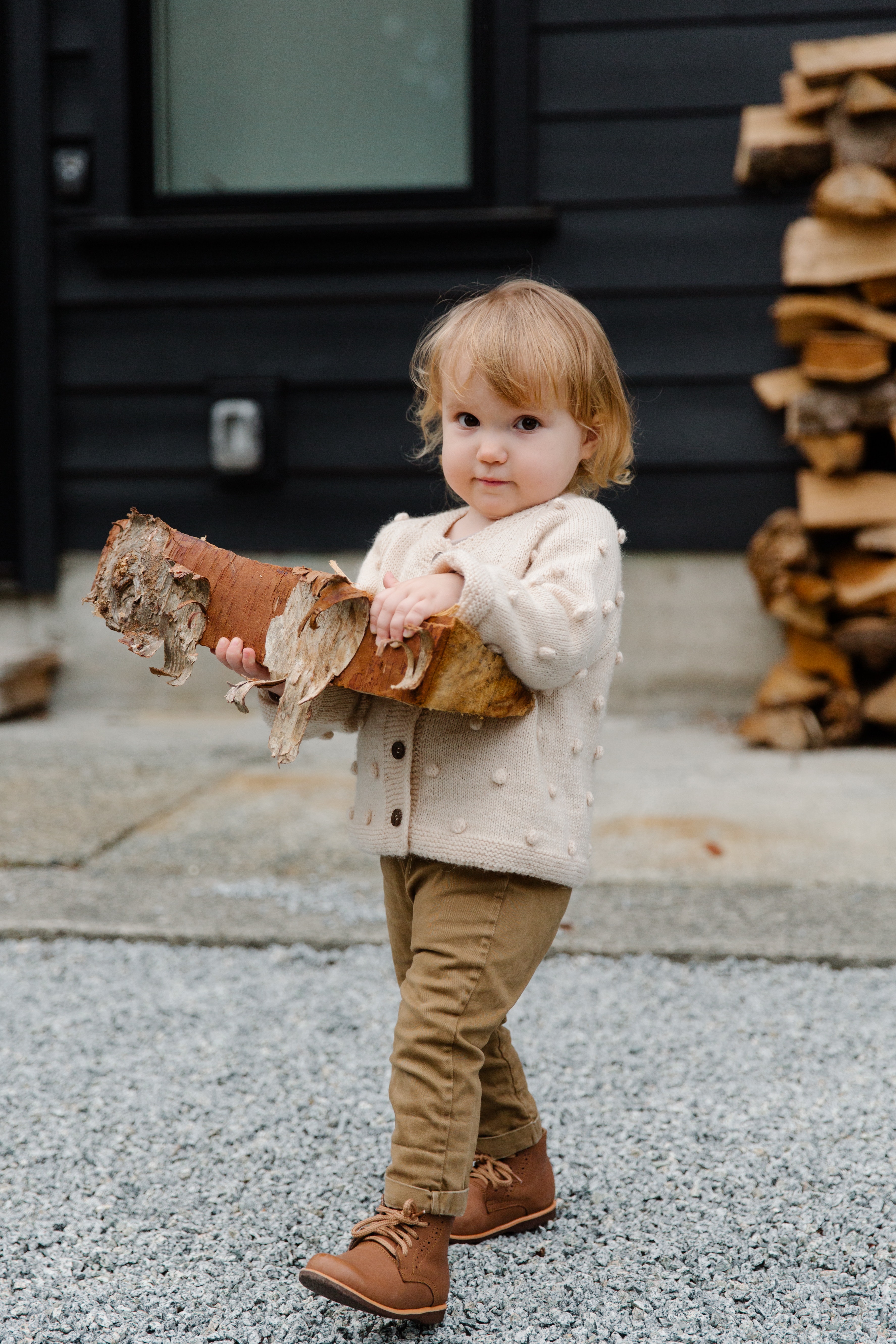 Girl carrying firewood with birchbark